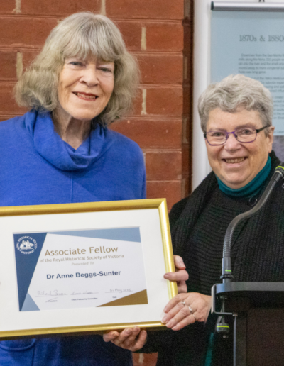 Dr Anne Beggs-Sunter, holding the certificate announcing her Associate Fellows of the RHSV, and Judith Smart OAM