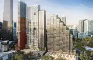 Architectural rendering of Gurrowa development showing multiple modern high-rise residential towers of varying heights with glass and concrete facades, integrated with lower-level commercial buildings, set among existing city skyline and green spaces.
